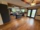 Open concept kitchen featuring a center island, modern appliances, and hardwood floors at 7140 N Michigan Rd, Fairland, IN 46126