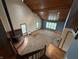 Spacious living room featuring a vaulted ceiling, wood accents, and a cozy fireplace at 7140 N Michigan Rd, Fairland, IN 46126