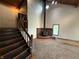 Open living room featuring a staircase, wood burning stove, wood accents, and natural light at 7140 N Michigan Rd, Fairland, IN 46126
