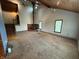 Spacious living room with a wood-burning stove, wood ceilings, and large windows with natural light at 7140 N Michigan Rd, Fairland, IN 46126