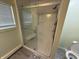 Modern glass shower with shower seat and white tile surround at 7140 N Michigan Rd, Fairland, IN 46126