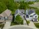 Aerial view of the street features well-manicured lawns, driveways, and lush landscaping at 7218 Antiquity Dr, Carmel, IN 46033