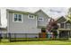The backyard has a well-manicured lawn and mature landscaping at 7218 Antiquity Dr, Carmel, IN 46033