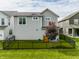Private fenced backyard featuring a manicured lawn and landscaping at 7218 Antiquity Dr, Carmel, IN 46033