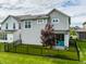 The home features a backyard with outdoor patio and a manicured lawn at 7218 Antiquity Dr, Carmel, IN 46033
