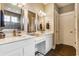 Bathroom with dual sinks, quartz countertops, and modern fixtures at 7218 Antiquity Dr, Carmel, IN 46033