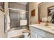 Bathroom featuring white vanity, framed mirror, shower, and toilet at 7218 Antiquity Dr, Carmel, IN 46033