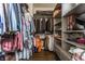 Walk-in closet with an ample hanging rack and storage at 7218 Antiquity Dr, Carmel, IN 46033