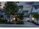 Charming two-story home featuring a covered front porch, attached garage, and well-manicured lawn at 7218 Antiquity Dr, Carmel, IN 46033