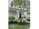Cozy front porch with a covered entrance, white columns, and tasteful landscaping, adding curb appeal at 7218 Antiquity Dr, Carmel, IN 46033