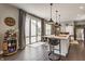 Kitchen features center island, backyard access, and barrel-themed decor at 7218 Antiquity Dr, Carmel, IN 46033