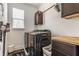Laundry room featuring dark washer/dryer with butcher block folding table at 7218 Antiquity Dr, Carmel, IN 46033