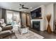 Inviting living room space with fireplace and patio access at 7218 Antiquity Dr, Carmel, IN 46033