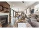Open concept living room with fireplace and view to kitchen at 7218 Antiquity Dr, Carmel, IN 46033