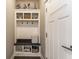 Mudroom area with storage cubbies and hooks near door at 7218 Antiquity Dr, Carmel, IN 46033