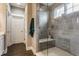 Walk-in shower features grey tiles, frameless glass, and a built-in bench at 7218 Antiquity Dr, Carmel, IN 46033