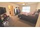 Inviting bedroom with a ceiling fan and large window at 728 Jefferson Park Dr, Pittsboro, IN 46167