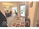 Inviting entryway featuring a colorful rug and convenient console table at 728 Jefferson Park Dr, Pittsboro, IN 46167