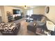 Cozy living room with comfortable seating, a large TV, and natural light at 728 Jefferson Park Dr, Pittsboro, IN 46167