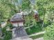 Overhead view of a brick home surrounded by lush greenery, showcasing its expansive lot and curb appeal at 7626 Timber Springs S Dr, Fishers, IN 46038