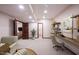 Finished basement area features neutral carpeting and a home office setup at 7626 Timber Springs S Dr, Fishers, IN 46038
