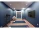 A basement home gym including weights, a yoga ball, and a large mirror at 7626 Timber Springs S Dr, Fishers, IN 46038