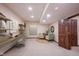 Cozy basement office area with built-in shelves, a desk, and comfortable seating at 7626 Timber Springs S Dr, Fishers, IN 46038