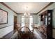 Dining room with traditional details including wood trim and large windows at 7626 Timber Springs S Dr, Fishers, IN 46038