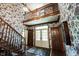 Elegant foyer with hardwood floors, staircase and wallpaper with views to front door and second floor at 7626 Timber Springs S Dr, Fishers, IN 46038