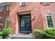 Home's attractive brick facade is complemented by a stylish double front door and manicured plants at 7626 Timber Springs S Dr, Fishers, IN 46038