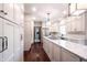 Updated kitchen with white cabinets, hardwood floors, stainless steel appliances and a spacious center island at 7626 Timber Springs S Dr, Fishers, IN 46038