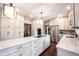 Bright kitchen with granite countertops, hardwood floors, stainless appliances, and an island at 7626 Timber Springs S Dr, Fishers, IN 46038