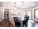 A beautifully updated kitchen offers white cabinets, stainless appliances, and hardwood floors at 7626 Timber Springs S Dr, Fishers, IN 46038