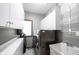 Laundry room with front-load washer, dryer, sink, and ample storage at 7626 Timber Springs S Dr, Fishers, IN 46038