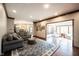 Open concept living room boasts hardwood floors, recessed lighting, and flows into sunroom and kitchen at 7626 Timber Springs S Dr, Fishers, IN 46038