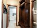 Mudroom featuring a storage bench and adjacent laundry room at 7626 Timber Springs S Dr, Fishers, IN 46038