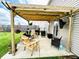Cozy patio area featuring a pergola, outdoor seating, and a grill for entertainment at 7804 Amadeus Dr, Indianapolis, IN 46239
