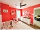 Bright Bedroom featuring red walls, white crib, and cozy decor at 7804 Amadeus Dr, Indianapolis, IN 46239