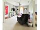 Carpeted bedroom featuring neutral walls, a ceiling fan, and play area at 7804 Amadeus Dr, Indianapolis, IN 46239