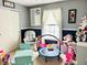 Playroom featuring blue walls, a small trampoline, and an assortment of toys at 7804 Amadeus Dr, Indianapolis, IN 46239