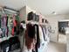Walk-in closet with built-in shelving and hanging racks, providing ample storage space at 7804 Amadeus Dr, Indianapolis, IN 46239
