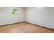 Bright bedroom featuring hardwood floors, neutral walls, and one window letting in natural light at 8140 Valley Estates Dr, Indianapolis, IN 46227