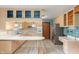 Kitchen with wood cabinets, stainless steel appliances, and a breakfast bar at 8140 Valley Estates Dr, Indianapolis, IN 46227