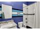 This bathroom features a vanity with a marble top and a tub with white subway tile at 829 Olive St, Indianapolis, IN 46203