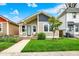 Charming bungalow with a freshly cut lawn and cozy front porch sitting area, perfect for enjoying the outdoors at 829 Olive St, Indianapolis, IN 46203
