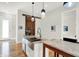Well-designed kitchen with granite countertops, stainless steel sink, and open access to the living area, great for entertaining at 829 Olive St, Indianapolis, IN 46203