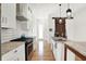 Stylish kitchen featuring white cabinets, stainless steel appliances, and granite countertops for a modern feel at 829 Olive St, Indianapolis, IN 46203