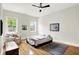 Spacious main bedroom boasting hardwood floors, natural light, and a calming atmosphere, perfect for relaxation at 829 Olive St, Indianapolis, IN 46203
