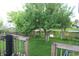 Private backyard featuring lush green grass and mature trees, plus a wood fence at 8551 Walden Trace Dr, Indianapolis, IN 46278