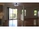 Dining area with wood floors, sliding glass doors to the patio, and open to the kitchen at 8551 Walden Trace Dr, Indianapolis, IN 46278